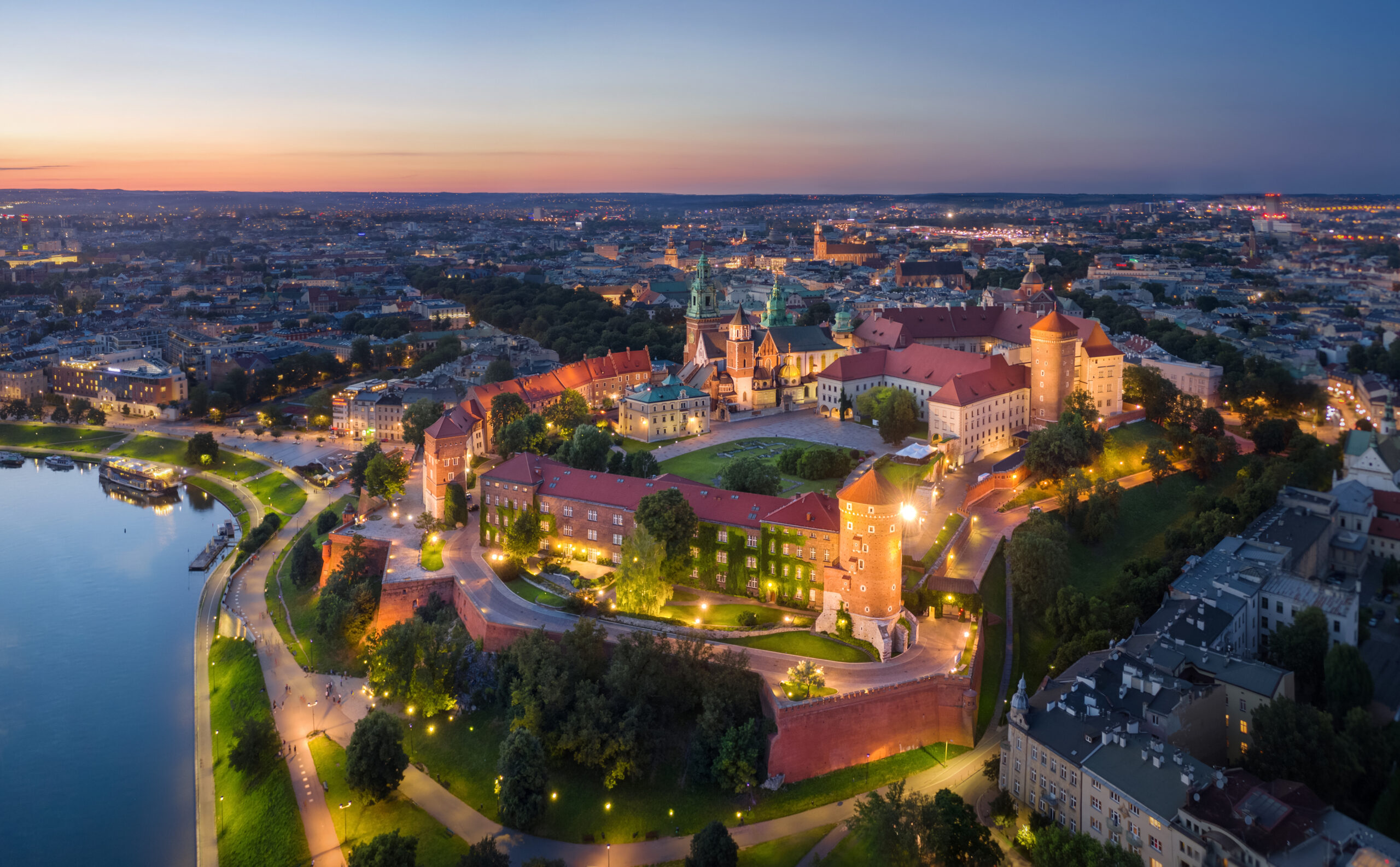 Krakow, Poland. Aerial view of illuminated Wawel Royal Castle on sunset
